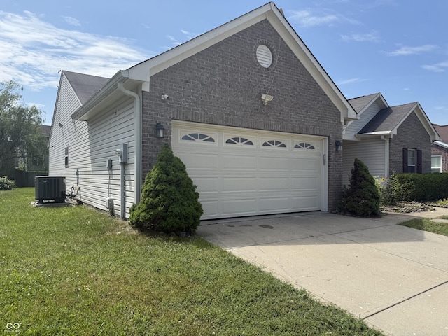 2929 Tuscarora Ln, Indianapolis, IN 46217 - view of property exterior featuring brick siding, driveway, a garage, and a yard