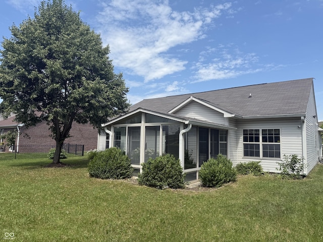 2929 Tuscarora Ln, Indianapolis, IN 46217 - back of property featuring a sunroom and a shingled roof