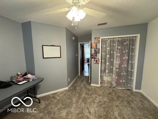 2230 Cedarmill Dr, Franklin, IN 46131 - bedroom with carpet flooring, a textured ceiling, a desk, and ceiling fan