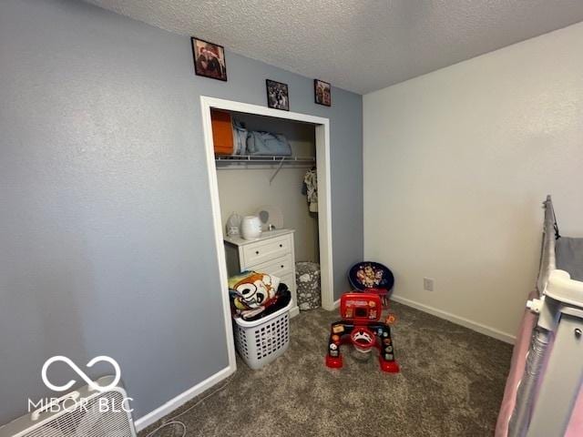 2230 Cedarmill Dr, Franklin, IN 46131 - bedroom featuring a textured ceiling, carpet, and a closet