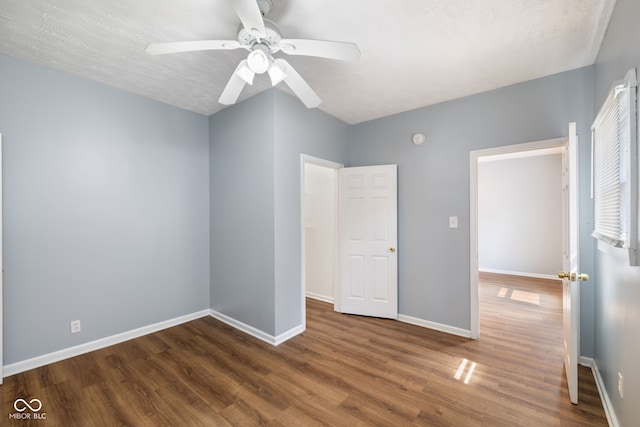 615 Udell St, Indianapolis, IN 46208 - unfurnished bedroom with wood finished floors and ceiling fan