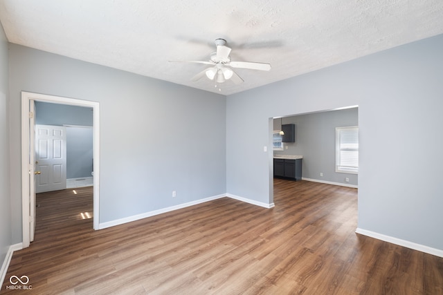 615 Udell St, Indianapolis, IN 46208 - empty room with a ceiling fan, wood finished floors, and a textured ceiling