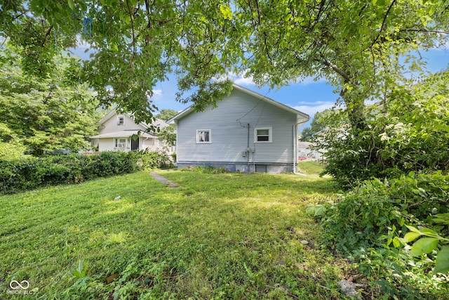 615 Udell St, Indianapolis, IN 46208 - back of property featuring a yard