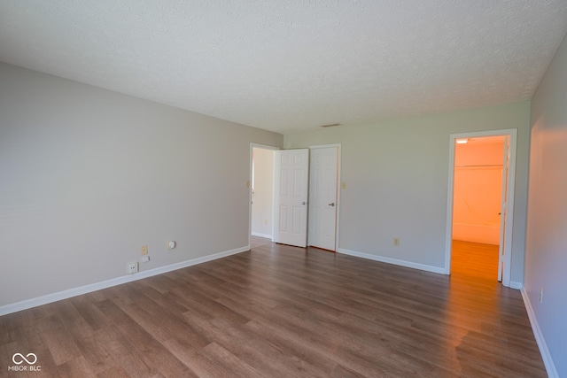 6029 Sycamore Forge Dr, Indianapolis, IN 46254 - unfurnished bedroom featuring dark wood-type flooring and baseboards
