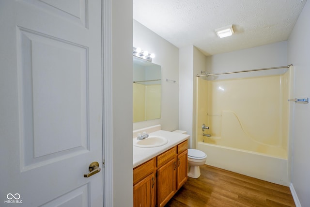 6029 Sycamore Forge Dr, Indianapolis, IN 46254 - bathroom with vanity, wood finished floors, shower / bath combination, and a textured ceiling