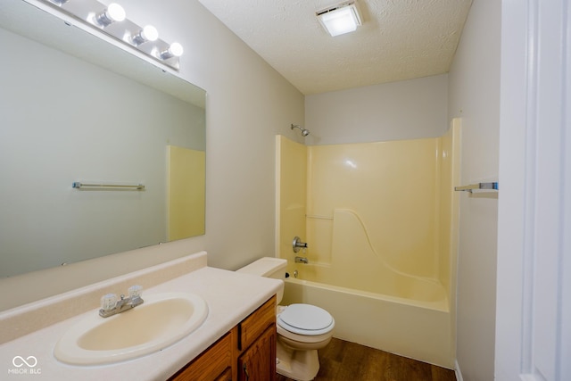 6029 Sycamore Forge Dr, Indianapolis, IN 46254 - bathroom featuring vanity, wood finished floors, shower / bathtub combination, and a textured ceiling