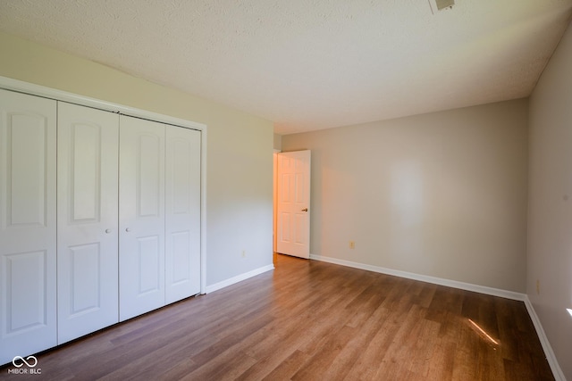 6029 Sycamore Forge Dr, Indianapolis, IN 46254 - unfurnished bedroom featuring wood finished floors and a closet