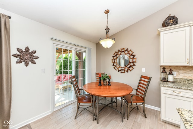5765 White Pine Rd, Whitestown, IN 46075 - dining space with light wood-style floors and baseboards