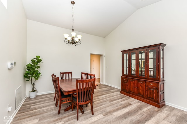 5765 White Pine Rd, Whitestown, IN 46075 - dining space with a chandelier, light wood-type flooring, and high vaulted ceiling