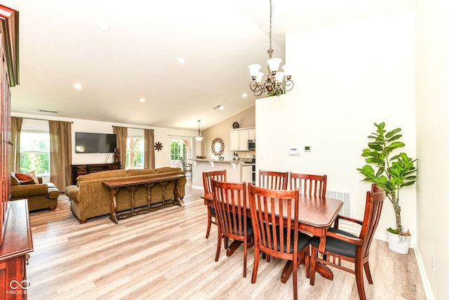 5765 White Pine Rd, Whitestown, IN 46075 - dining room featuring light wood-style floors, lofted ceiling, a chandelier, and recessed lighting