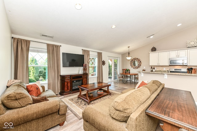 5765 White Pine Rd, Whitestown, IN 46075 - living room with vaulted ceiling, plenty of natural light, light wood-style flooring, and recessed lighting