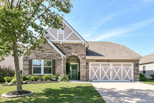 5765 White Pine Rd, Whitestown, IN 46075 - english style home with brick siding, an attached garage, driveway, and a front yard