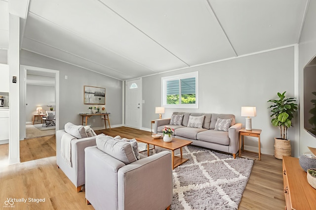 212 N 13th St, Elwood, IN 46036 - living room featuring light wood-type flooring and lofted ceiling