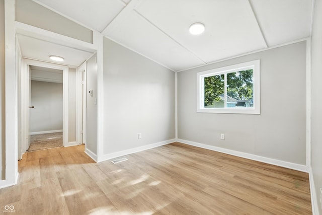 212 N 13th St, Elwood, IN 46036 - unfurnished bedroom featuring light wood finished floors and lofted ceiling