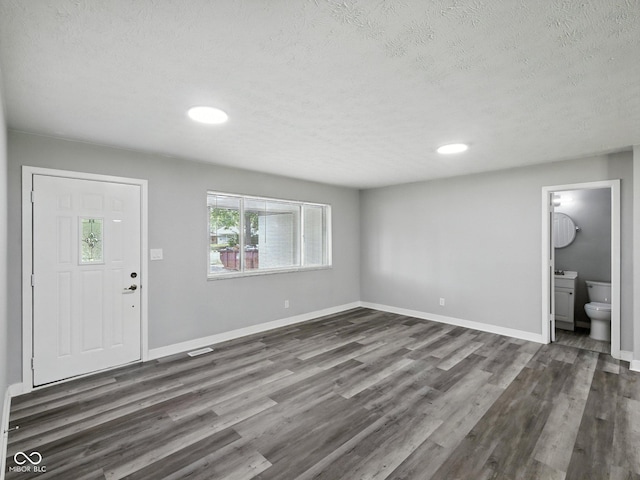 2853 S State Ave, Indianapolis, IN 46203 - entryway with a textured ceiling, dark wood-type flooring, and recessed lighting