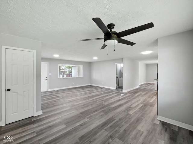2853 S State Ave, Indianapolis, IN 46203 - empty room with ceiling fan, wood finished floors, a textured ceiling, and recessed lighting