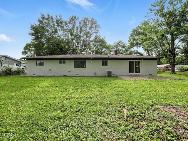 2853 S State Ave, Indianapolis, IN 46203 - back of property with crawl space, a patio area, and a lawn