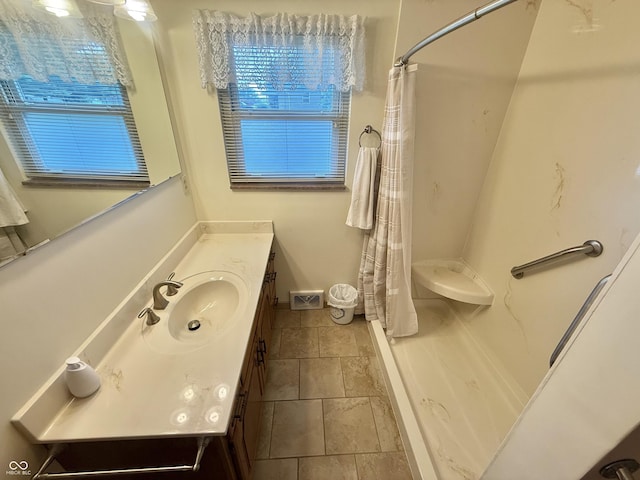 605 Redding Rd, Seymour, IN 47274 - full bathroom with stone tile flooring, vanity, and a shower with shower curtain