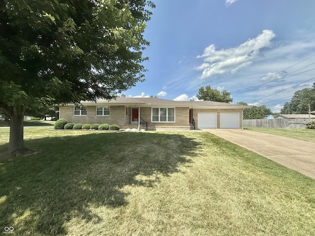 605 Redding Rd, Seymour, IN 47274 - ranch-style house featuring a garage, concrete driveway, and stone siding