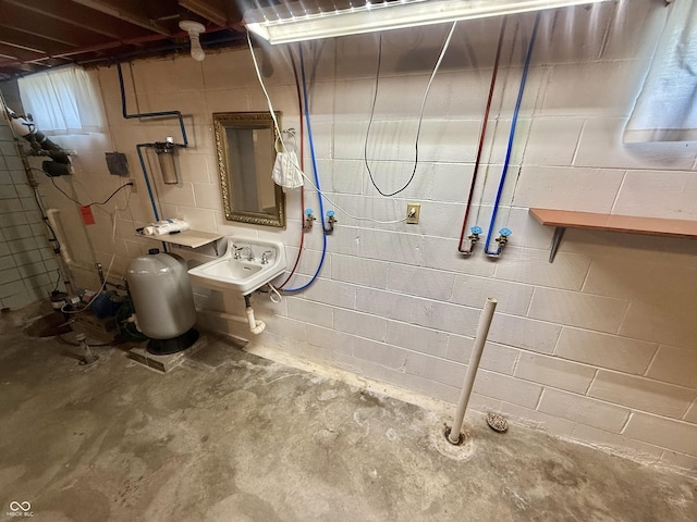 605 Redding Rd, Seymour, IN 47274 - unfinished basement with concrete block wall and a sink