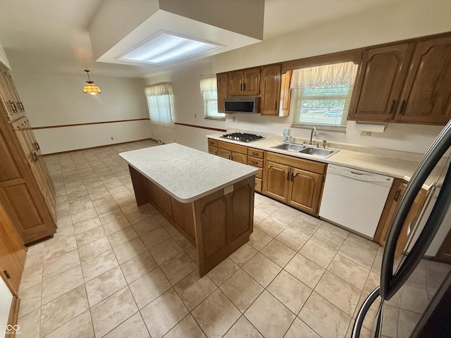 605 Redding Rd, Seymour, IN 47274 - kitchen featuring stainless steel appliances, light tile patterned flooring, light countertops, a kitchen island, and plenty of natural light