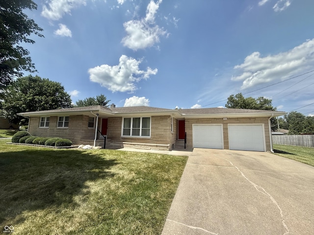 605 Redding Rd, Seymour, IN 47274 - ranch-style home with a garage, stone siding, and concrete driveway