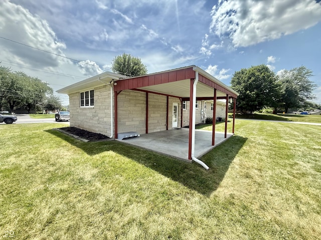 605 Redding Rd, Seymour, IN 47274 - view of home's exterior featuring a lawn, a patio area, and stone siding