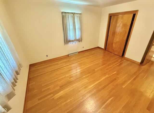 605 Redding Rd, Seymour, IN 47274 - unfurnished bedroom with light wood finished floors and a closet