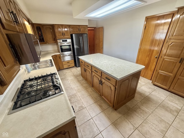 605 Redding Rd, Seymour, IN 47274 - kitchen with appliances with stainless steel finishes, a warming drawer, light countertops, and a center island