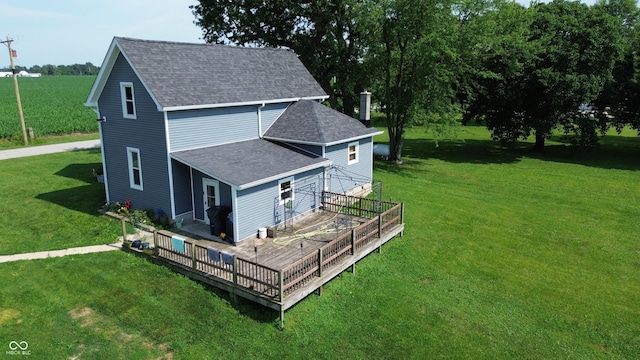9721 S 100 E, Pendleton, IN 46064 - view of side of property featuring a shingled roof, a yard, and a wooden deck
