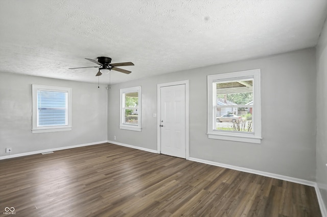 3609 N Keystone Ave, Indianapolis, IN 46218 - foyer with a textured ceiling, dark wood finished floors, healthy amount of natural light, and ceiling fan