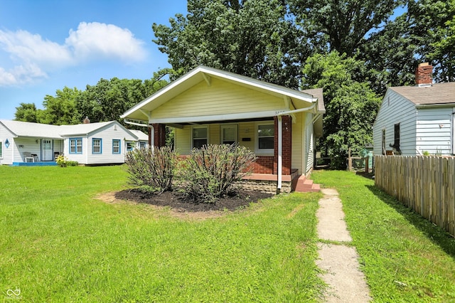 3609 N Keystone Ave, Indianapolis, IN 46218 - view of front facade with a porch and brick siding