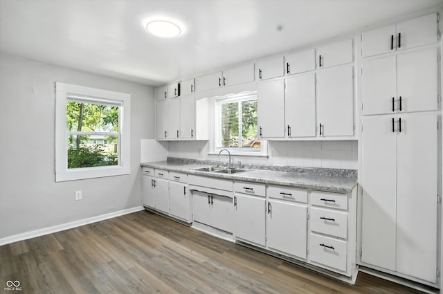 3609 N Keystone Ave, Indianapolis, IN 46218 - kitchen with plenty of natural light, light countertops, wood finished floors, and white cabinets