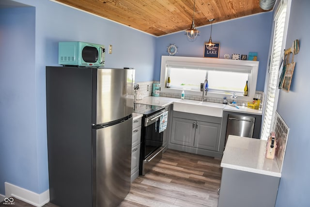 206 Olive St, Arcadia, IN 46030 - kitchen featuring appliances with stainless steel finishes, wooden ceiling, gray cabinets, wood finished floors, and lofted ceiling