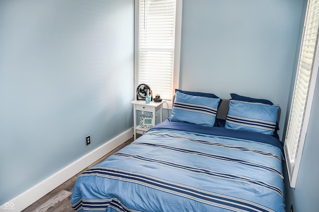 206 Olive St, Arcadia, IN 46030 - bedroom with baseboards and wood finished floors