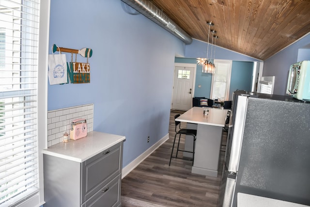206 Olive St, Arcadia, IN 46030 - kitchen with freestanding refrigerator, gray cabinets, vaulted ceiling, wooden ceiling, and dark wood-type flooring