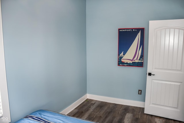 206 Olive St, Arcadia, IN 46030 - unfurnished bedroom with dark wood finished floors and baseboards