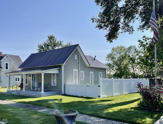 206 Olive St, Arcadia, IN 46030 - back of house featuring a porch and a metal roof