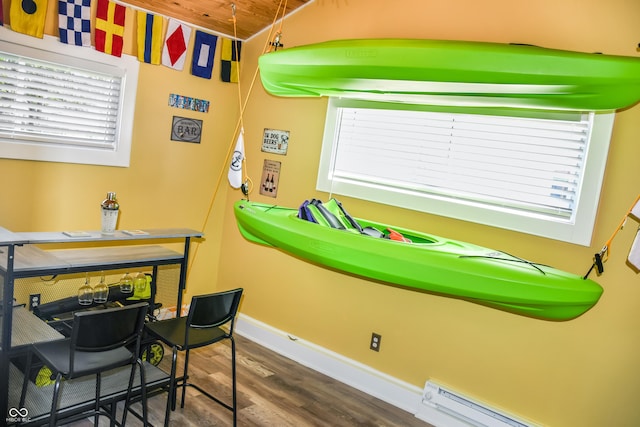 206 Olive St, Arcadia, IN 46030 - recreation room featuring wood finished floors, a baseboard radiator, plenty of natural light, and wooden ceiling