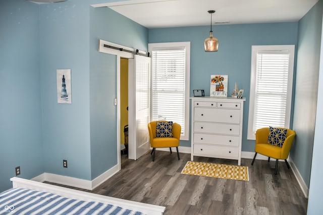 206 Olive St, Arcadia, IN 46030 - living area with a barn door and dark wood-style floors