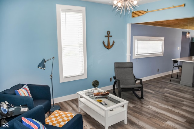 206 Olive St, Arcadia, IN 46030 - living room with a chandelier and wood finished floors