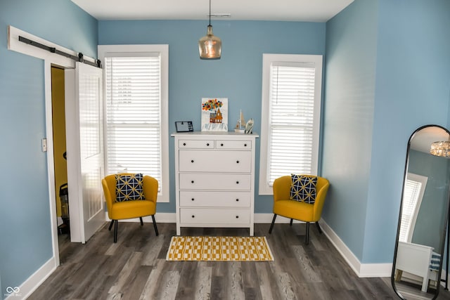 206 Olive St, Arcadia, IN 46030 - sitting room with a barn door, dark wood-style floors, and healthy amount of natural light
