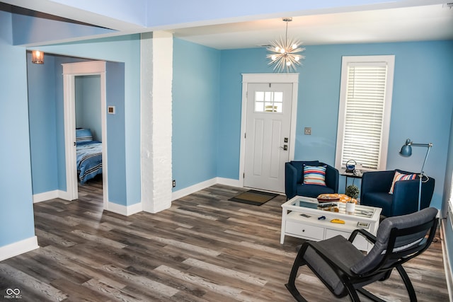 206 Olive St, Arcadia, IN 46030 - entryway with wood finished floors and a chandelier