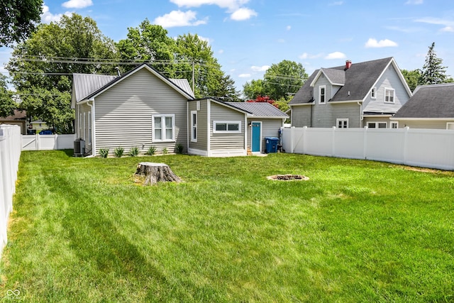 206 Olive St, Arcadia, IN 46030 - back of property with a fenced backyard and a fire pit