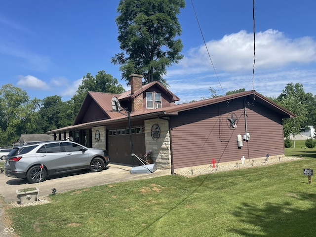 100 Durbin St, North Vernon, IN 47265 - view of property exterior featuring an attached garage, a yard, a chimney, driveway, and stone siding