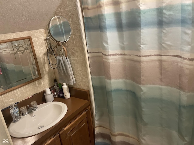 100 Durbin St, North Vernon, IN 47265 - bathroom featuring vanity, tasteful backsplash, curtained shower, and tile walls
