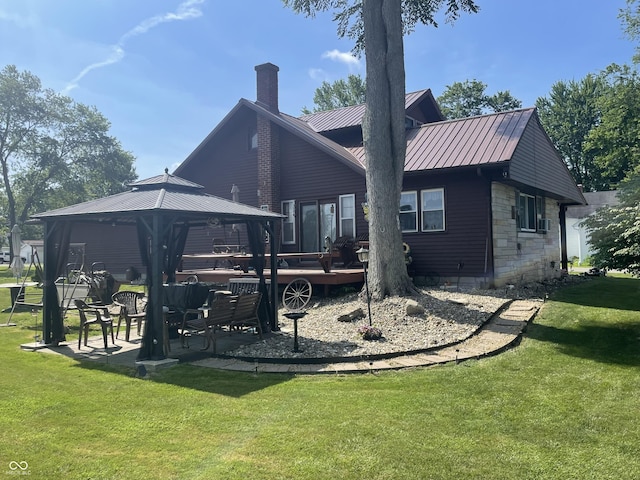 100 Durbin St, North Vernon, IN 47265 - rear view of property with a gazebo, a chimney, a yard, a metal roof, and stone siding