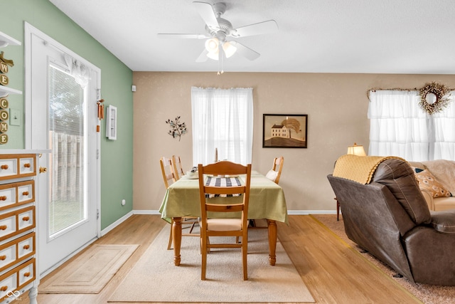 1912 Blue Pine Ln, Indianapolis, IN 46231 - dining room featuring light wood finished floors and ceiling fan