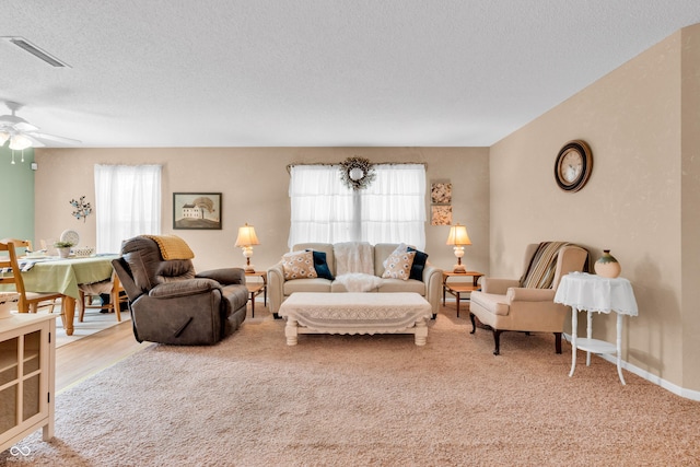 1912 Blue Pine Ln, Indianapolis, IN 46231 - living area with carpet, a textured ceiling, and ceiling fan