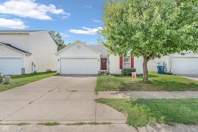1912 Blue Pine Ln, Indianapolis, IN 46231 - view of front of house with driveway, a front yard, and a garage